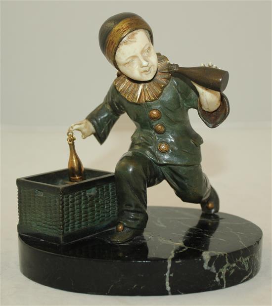 O. Gerard. An early 20th century bronze and ivory figure of a child pierrot, height overall 5.75in.